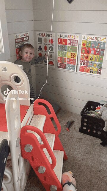 A toddler at the poster wall, from a real customer review